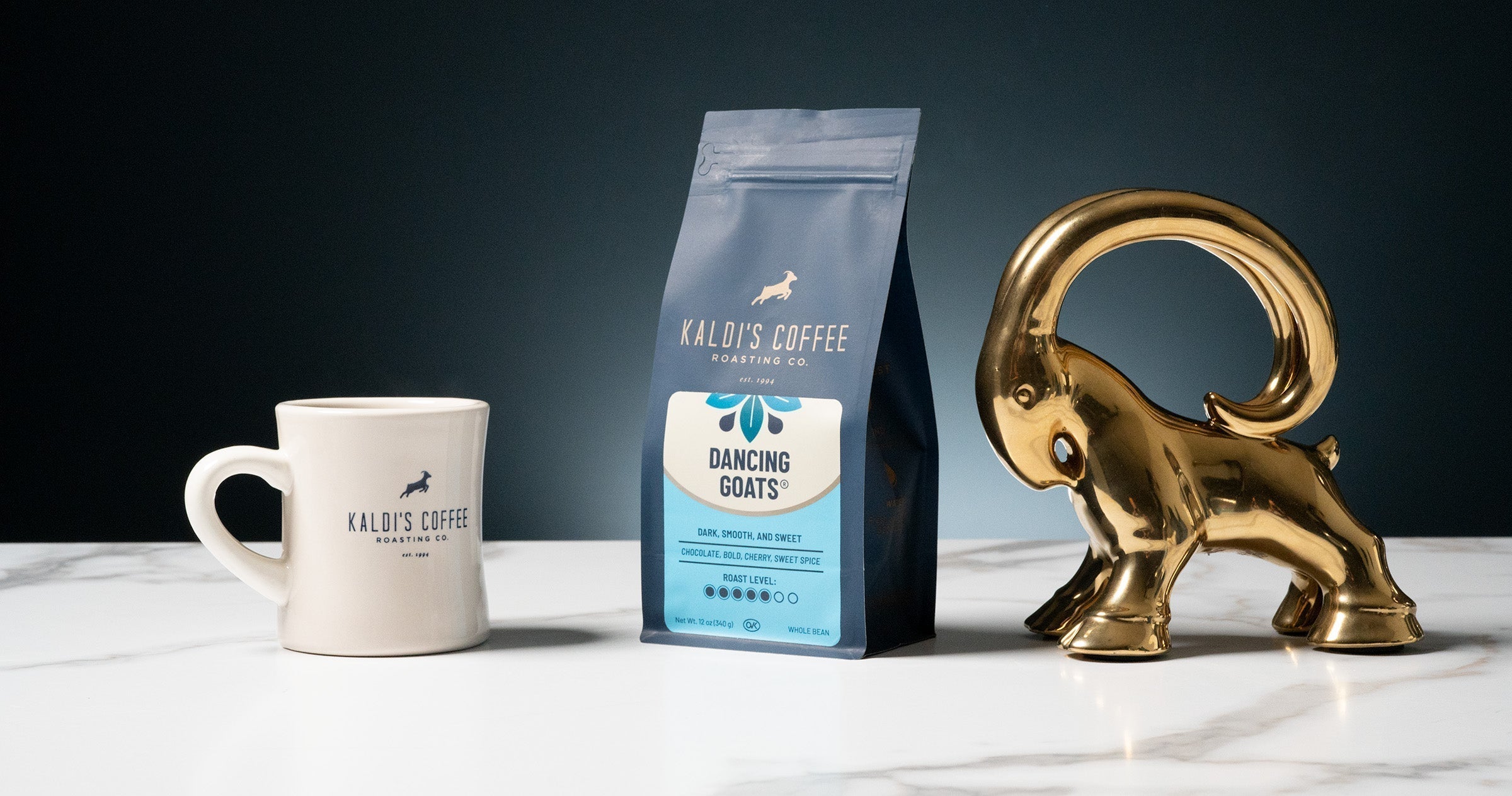 A small bag of Kaldi's Coffee "Dancing Goats" coffee and a Kaldi's Coffee mug