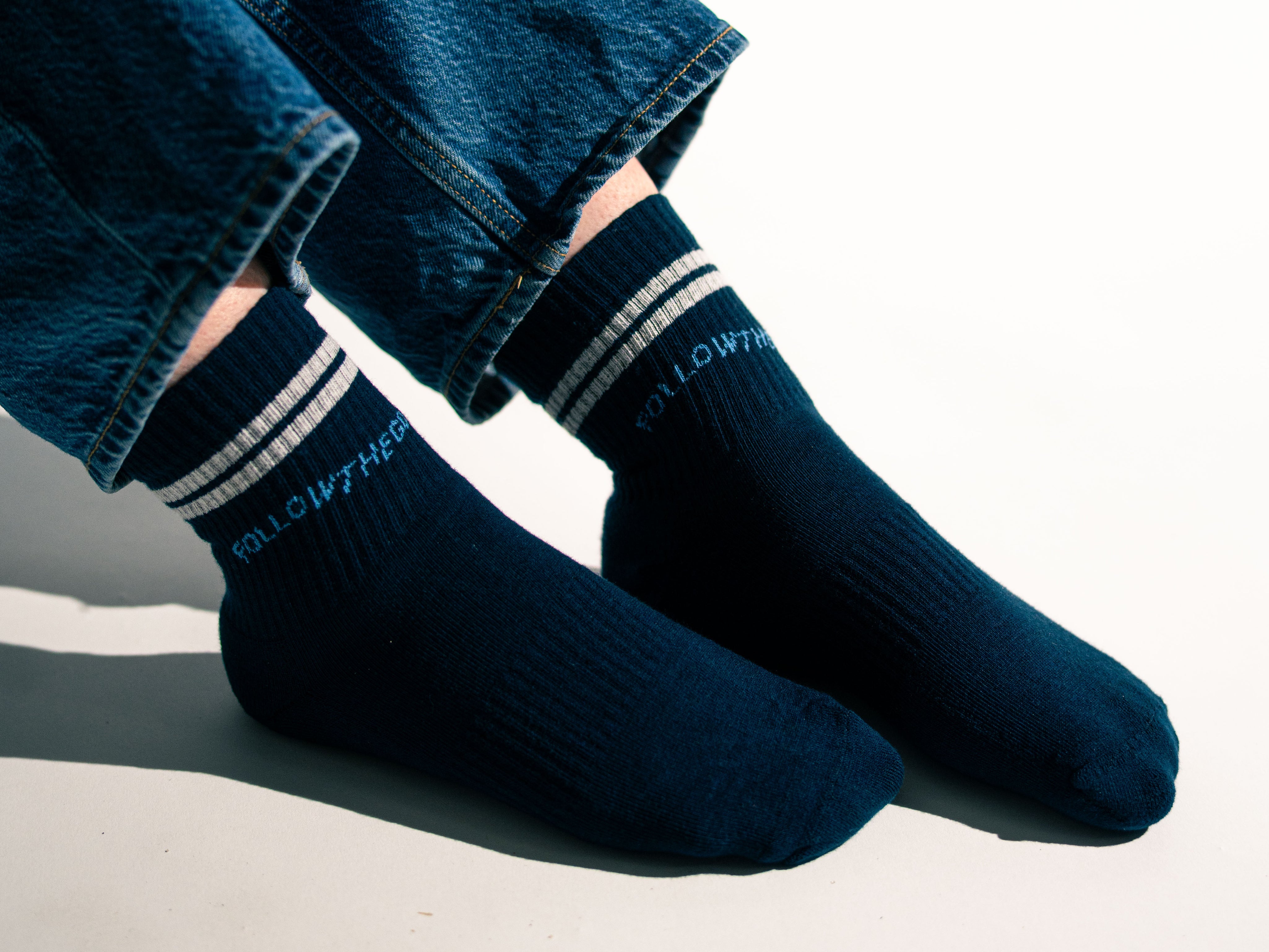 side view of model wearing navy socks