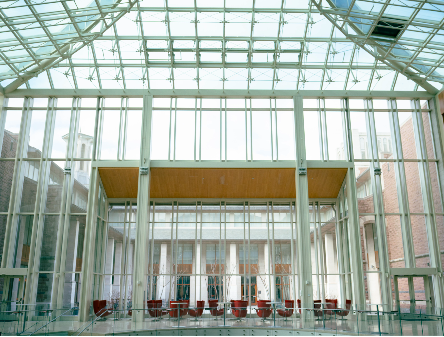 Modern building interior with glass ceiling and walls