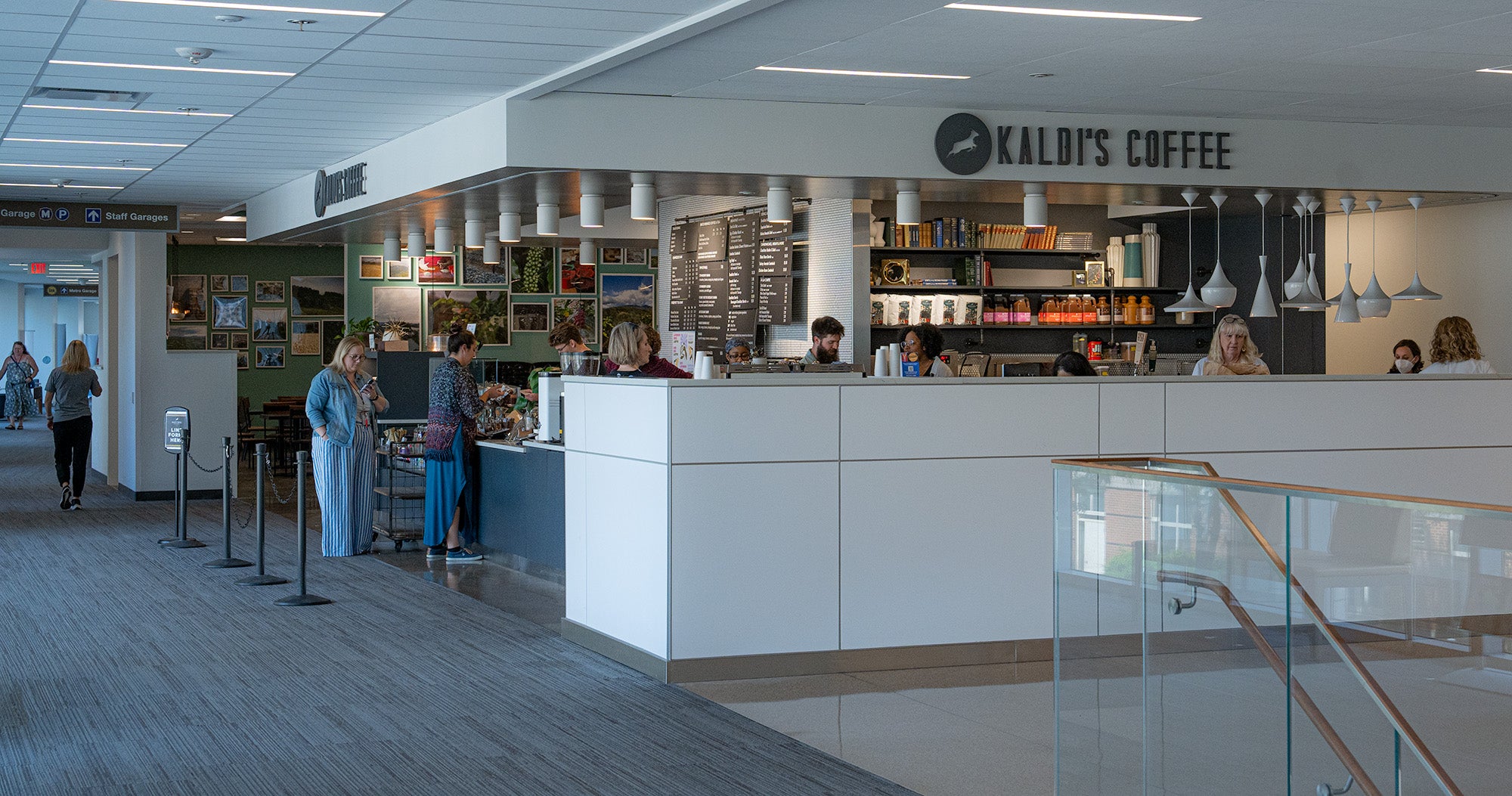 Coffee shop with 'Kaldi's Coffee' sign in a modern interior setting.
