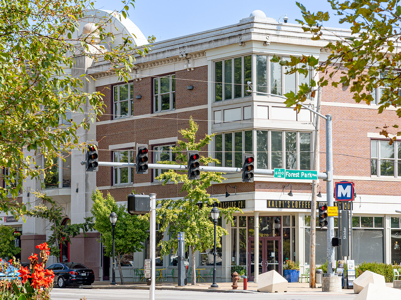 Street view of corner of Kaldi's Coffee on Forest Park Parkway