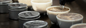 Pouring water into a cupping bowl at the Kaldi's Coffee St. Louis Roastery